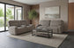 Caleb - Power Headrest Power Reclining Console Loveseat With Pop-Out Cupholders & Auto-Glide - Raisin
