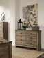 Trinell - Six Drawer Dresser - 61.34" x 15.98" x 42.99" - Brown Dark