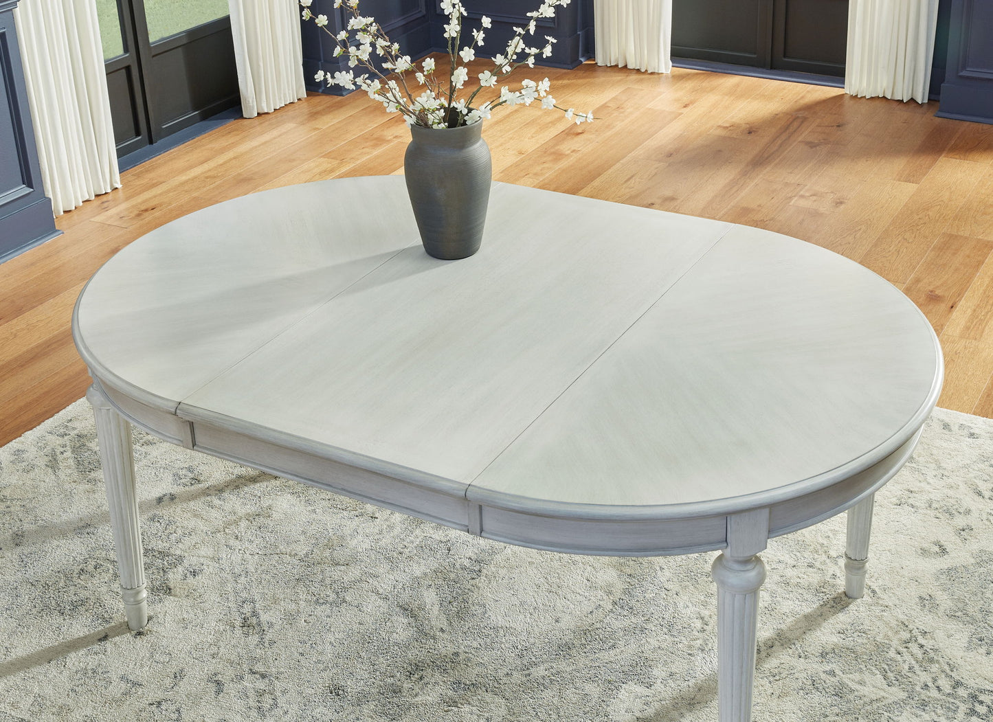 Montelaine - Oval Dining Room Extension Table - Antique White