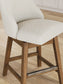 Cabalynn - Upholstered Swivel Barstool (Set of 2) - Oatmeal / Light Brown