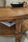 Chadworth - Round Cocktail Table - Medium Brown