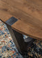 Hanneforth - Round Cocktail Table - Brown